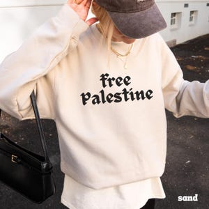 Human Rights Activist Clothing Solidarity Movement Support Apparel Protest Wear Awareness Statement Cotton Polyester Blend Crewneck Comfortable Design Statement Making Piece Social Justice Support Wear Meaningful Message Garment Quality