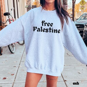 Statement Making Design Human Rights Activist Clothing Solidarity Movement Support Apparel Cotton Polyester Blend Crewneck Comfortable Wear Ribbed Collar Construction No Side Seams Quality Durable Fabric Social Justice Support Casual