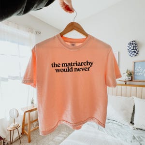 Vintage Style Matriarchy Feminist Tee Cotton Statement Shirt Equality Movement Design Womens Rights Message Activist Clothing Protest Rally Wear Comfortable Boxy Fit Quality Construction Ring Spun Cotton Heavy Fabric Shoulder Tape Perfect Gift Idea