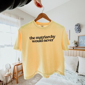 Quality Cotton Tee Shirt Feminist Statement Piece Activist Clothing Equality Movement Design Womens Rights Message Protest Rally Wear Vintage Style Look Comfortable Boxy Fit Ring Spun Material Heavy Fabric Construction Durable Daily Fashion