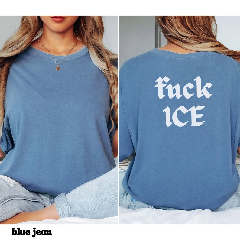 May include: A blue jean colored t-shirt with the text "fuck ICE" in white gothic font on the back. The front of the shirt is plain. The shirt is a crew neck and has short sleeves.