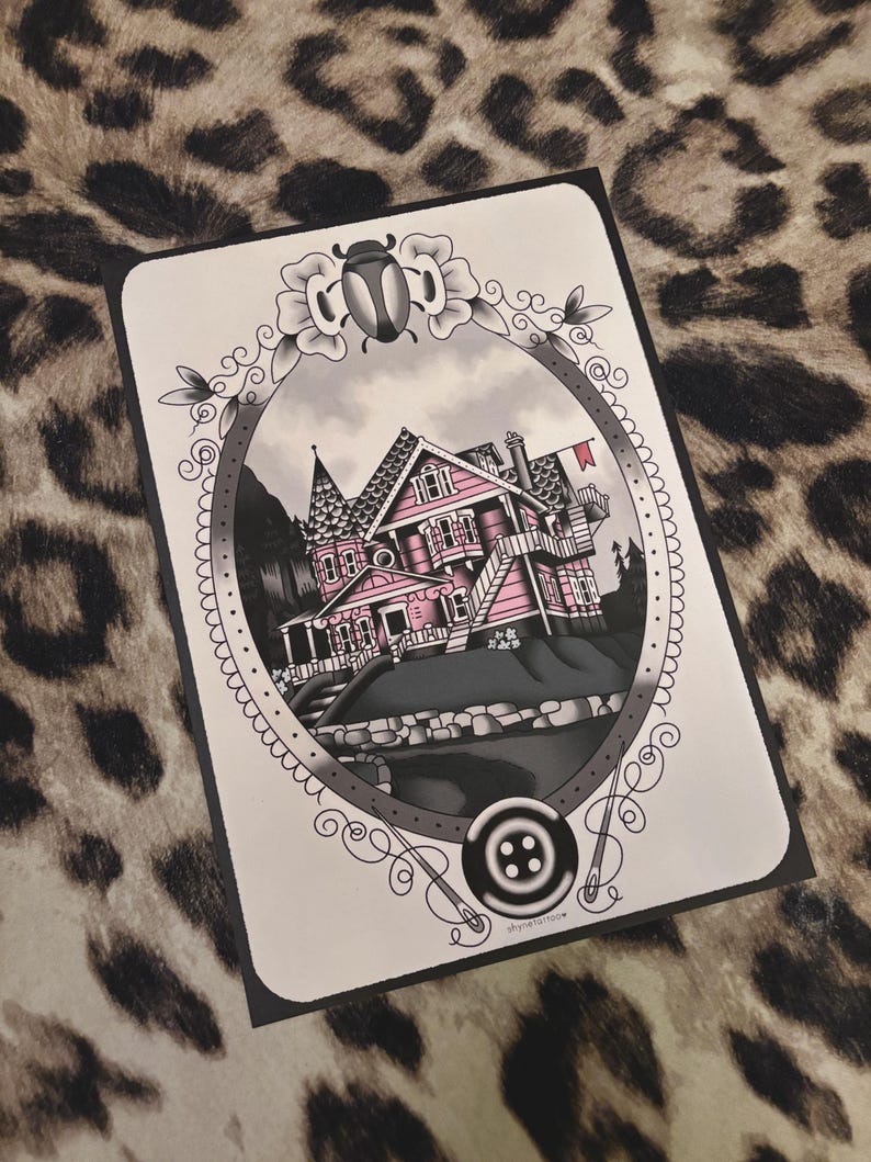 May include: A black and white illustration of a pink house with a red flag, framed by a decorative oval border with a beetle and button. The house has multiple stories and a detailed architectural design.