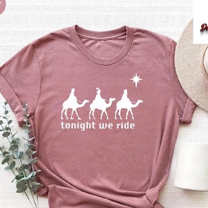 a t - shirt that says tonight we ride