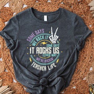 a t - shirt with a hand holding a peace sign on it