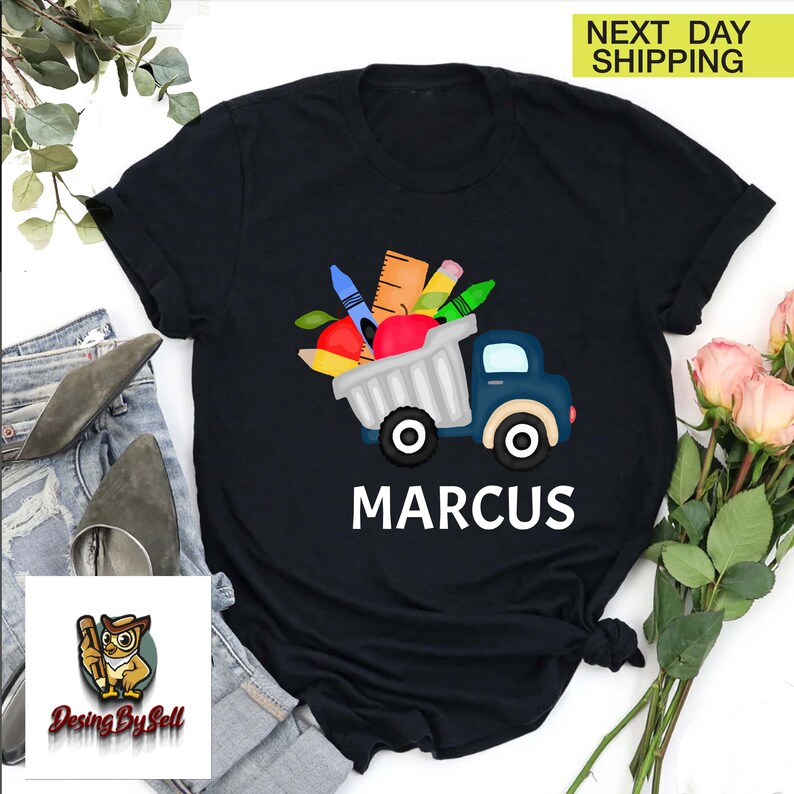 a black shirt with a truck filled with gifts