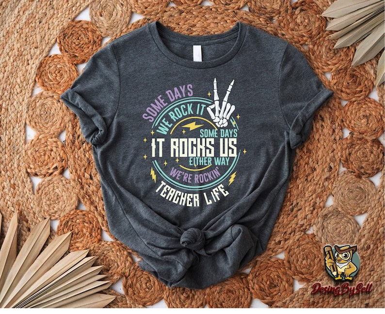a t - shirt with a hand holding a peace sign on it