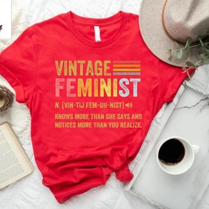a red shirt with the words vintage feminist on it