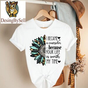 a white t - shirt with a sunflower on it