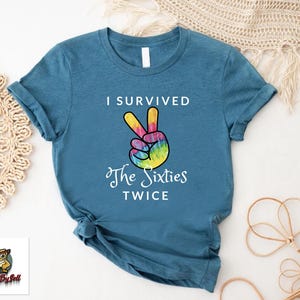 a t - shirt that says i survived the sixties twice