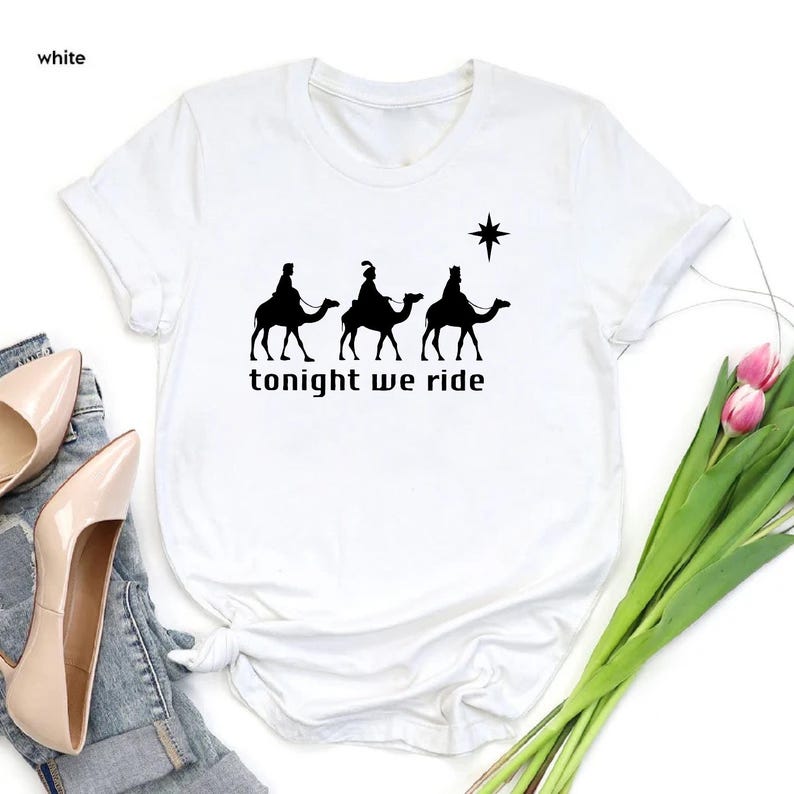 a t - shirt that says tonight we ride on a camel