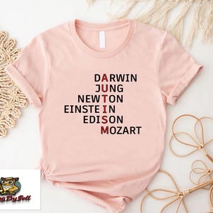 a pink t - shirt with the words drawn on it