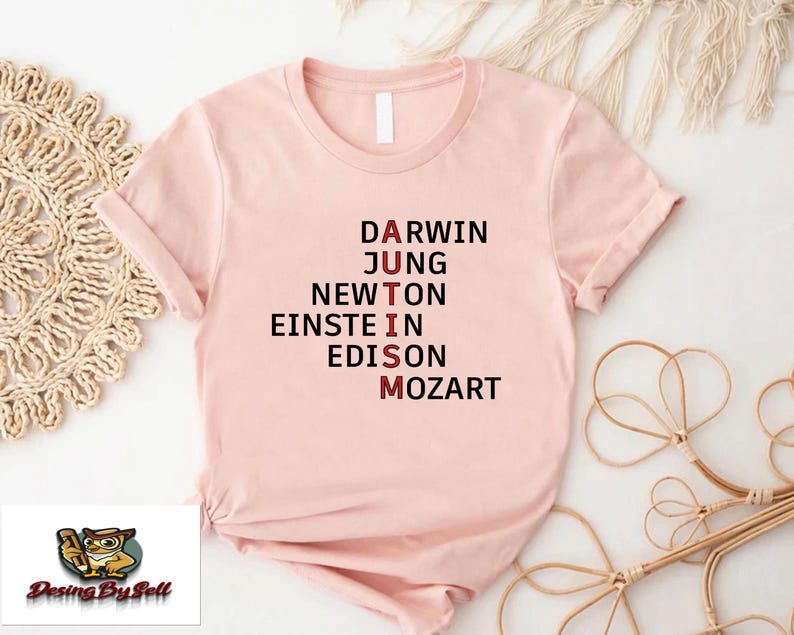 a pink t - shirt with the words drawn on it