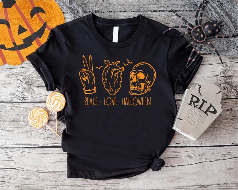 a black t - shirt with the words peace love halloween on it