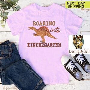a t - shirt that says roarin'into a kid's t -