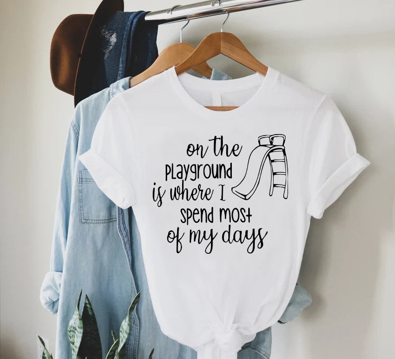 a t - shirt that says on the playground is where i spend most of my
