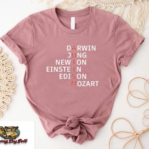 a pink t - shirt with the words d a r n d n n n