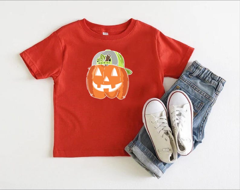 a pair of jeans and a t - shirt with a pumpkin on it