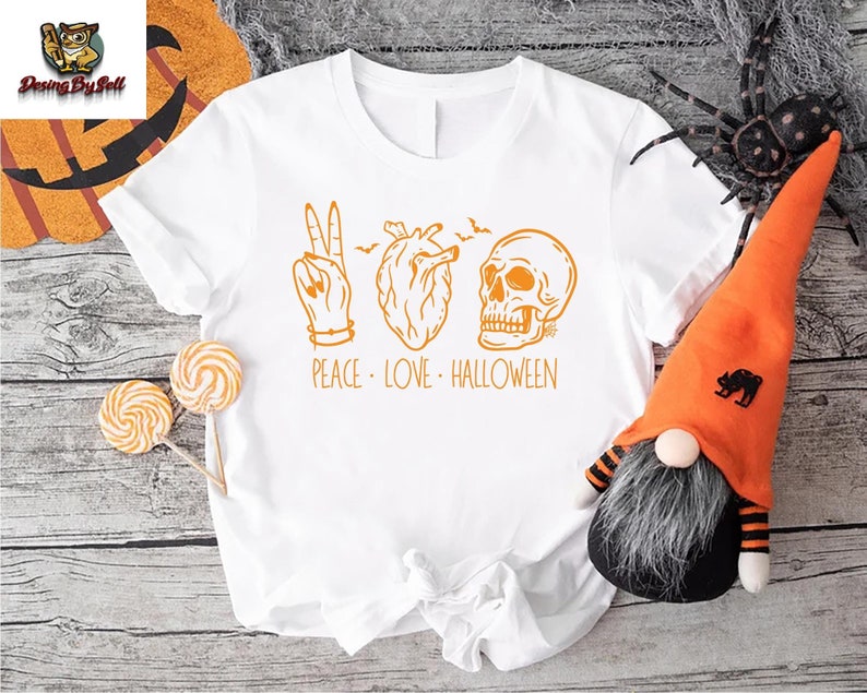 a white t - shirt with a halloween design on it