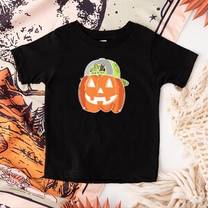 a black shirt with a pumpkin on it