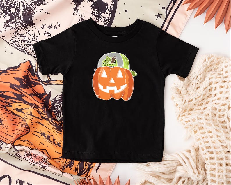 a black shirt with a pumpkin on it