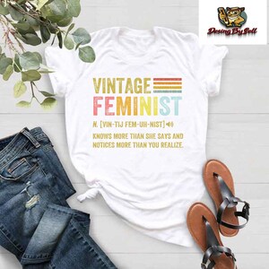 a t - shirt with the words vintage feminist on it