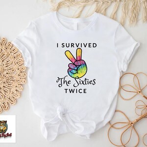 a t - shirt that says i survived the sixties twice