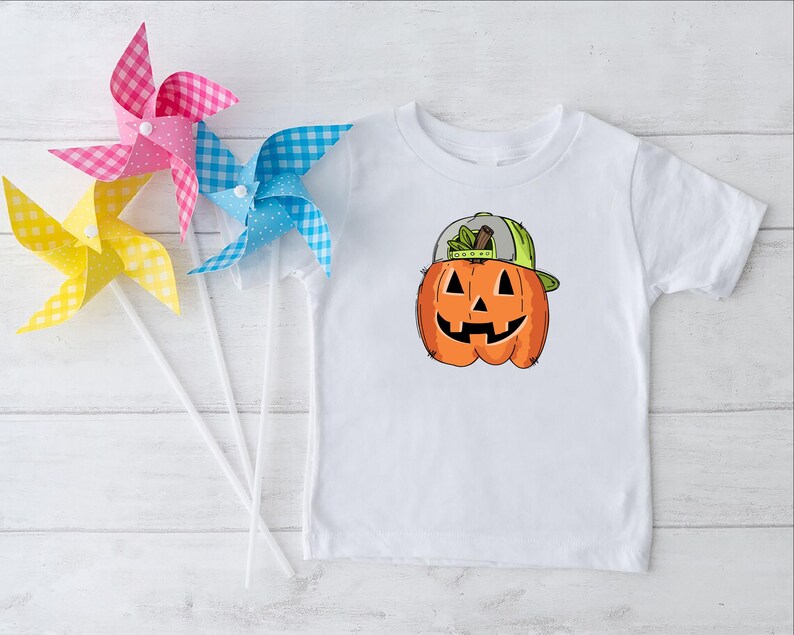 a white t - shirt with a pumpkin on it