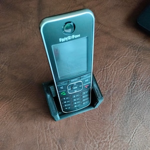 holder for cordless phone or smartphone