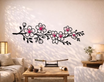May include: A black metal wall art piece depicting a branch of cherry blossoms. The flowers have white petals with pink centers. The art piece is mounted on a light-colored wall, creating a striking contrast.