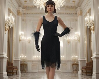 May include: A black flapper dress with a V-neck and fringe detail. The dress is paired with long black gloves with feather accents. The woman is standing in a grand hall with chandeliers and ornate decor.