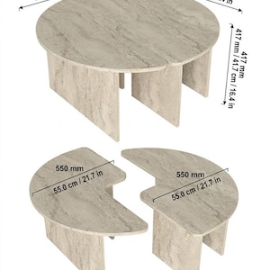 May include: A set of two beige stone-textured tables with a curved design. When joined, they form a circle measuring 35.4 inches in diameter and 16.4 inches in height. Separated, each piece measures 21.7 inches across. The tables feature panel legs.