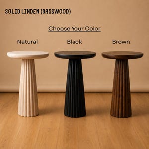 May include: Three solid linden basswood side tables with round tops and fluted pedestal bases. The text reads SOLID LINDEN (BASSWOOD), Choose Your Colour, Natural, Black, and Brown. The tables are shown in light wood, black, and dark brown finishes.