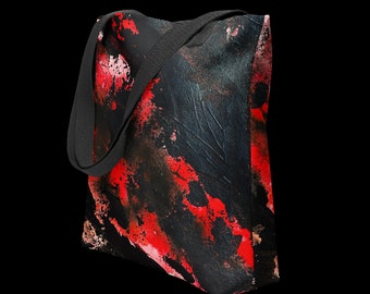 Peut inclure: Sac fourre-tout noir avec des éclaboussures de peinture abstraite rouge et blanche. Le sac a des anses noires.