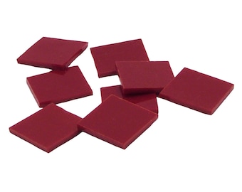May include: Eight burgundy red square tiles, scattered on a white background.