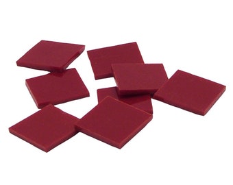 May include: A group of eight red diamond-shaped tiles. The tiles are scattered on a white background.