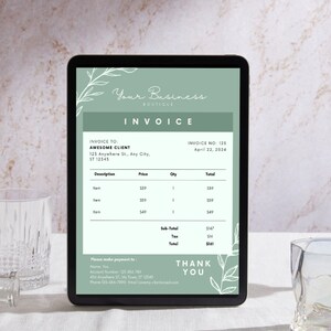 May include: A digital invoice on a tablet screen with a green background and white floral accents. The invoice is for Awesome Client and includes a list of items, prices, quantities, and totals. The invoice number is 123 and the date is April 22, 2024. The invoice also includes contact information for the business.