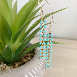 Fins up mint Enamel and gold dangle earrings