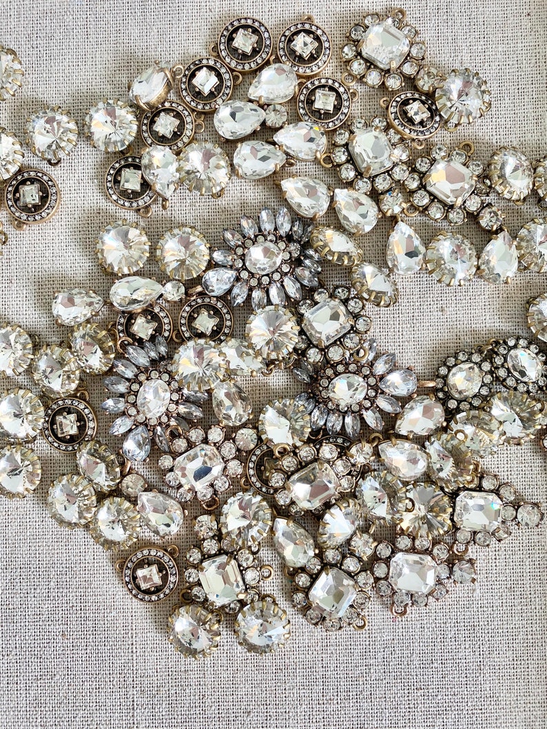 large lot of vintage reproduction crystal brass antique charms