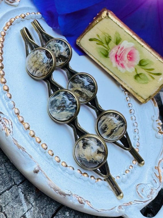 Handmade brass hairpins shaped like yellow watermelons — an unexpectedly whimsical bridal hair accessory that doubles as a tiny keepsake.