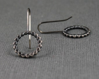 Sterling silver oxidized hammered french wire earrings.