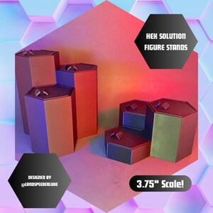 May include: Three hexagonal display stands made of brown and black plastic. The stands are arranged in a tiered formation. The stands are designed for displaying action figures and other collectibles. The text "HEX SOLUTION FIGURE STANDS" is printed in white on a black background. The text "3.75" Scale!" is printed in white on a black background. The text "DESIGNED BY @LANDSPEEDERLUKE" is printed in white on a black background.