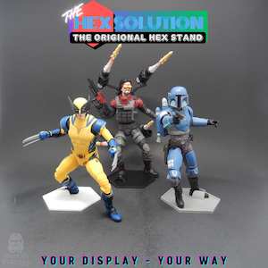 May include: Three action figures standing on hexagonal display bases. The text at the top reads THE HEX SOLUTION THE ORIGIONAL HEX STAND, and the text at the bottom reads YOUR DISPLAY - YOUR WAY. The figures are yellow and blue, red and black, and blue.