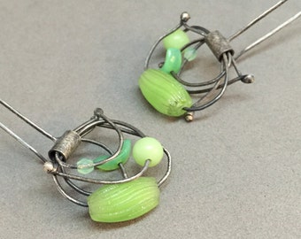 green seafoam dangle earrings kinetic earrings oxidized sterling sculptural statement earrings whimisical lime green vintage jadeite