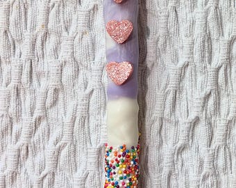 Palitos de pretzel decorados con chocolate blanco (1 docena)