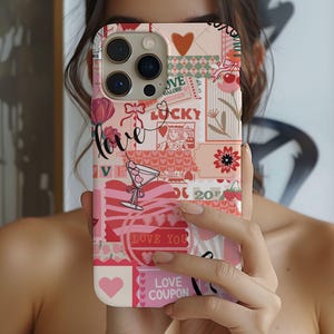 May include: A pink and white phone case featuring a collage of hearts, flowers, and other romantic designs. The case has a camera lens cutout and the text "Love Coupon".