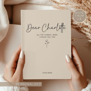 Personalized grief journal titled Dear Charlotte with soft beige cover, minimalist floral line art, and text reading All the things I wish I could tell you. A touching Letters to my Daughter journal for grief and loss of a child, designed as a sympathy gift for a daughter in heaven.