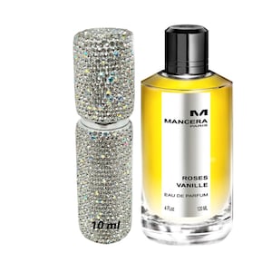 May include: A 10 ml sample bottle of Mancera Roses Vanille Eau de Parfum, a yellow fragrance with a diamond-encrusted cap, next to a 120 ml bottle of the same fragrance.