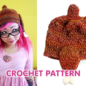 May include: A crocheted turkey hat with a brown, orange, and yellow color scheme. The hat has a long, thin tail that resembles a turkey leg. The hat is on a white background. CROCHET PATTERN is written in pink letters below the hat.