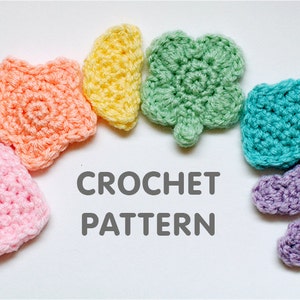 May include: A rainbow crochet pattern featuring a heart, star, clover, square, and horseshoe. The pattern is written as "CROCHET PATTERN".
