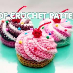 May include: Three crocheted cupcakes with colorful sprinkles and a red cherry on top. The cupcakes are on a teal plate. PDF CROCHET PATTERN is written in white text on a blue background.